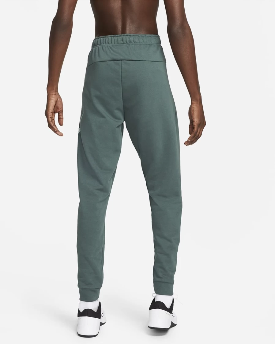 Nike Dri-FIT Men's Tapered Training Pants in Faded Spruce/Mica Green - Lightweight & Moisture-Wicking Workout Trousers